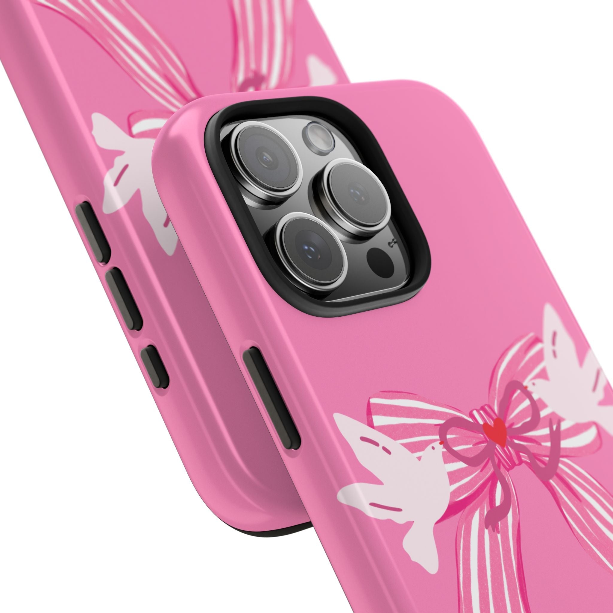 Close-up pink phone case with white bow print, camera lenses and side button cutouts