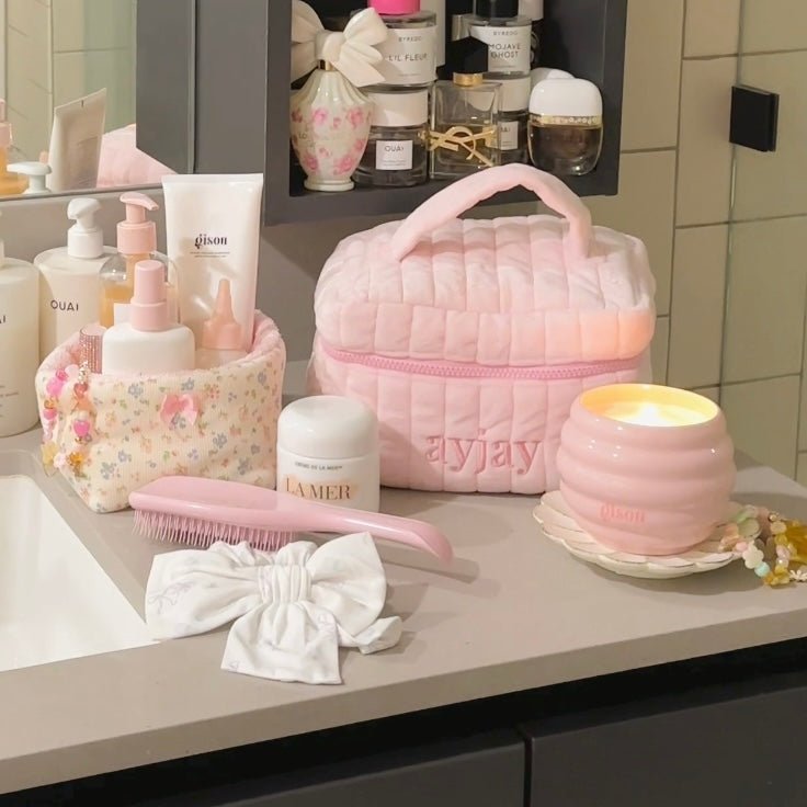 Pink quilted vanity bag with handle, open top with pink zipper border