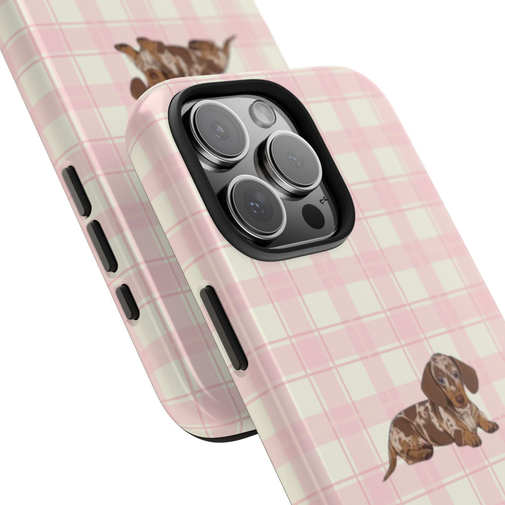 Pink gingham phone case with dachshund print, close-up of camera module and side cutouts