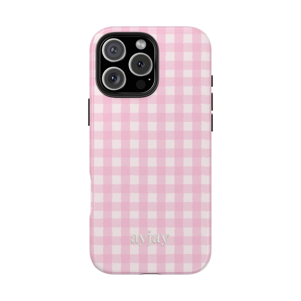 Pink gingham phone case with black camera cutout and lens openings