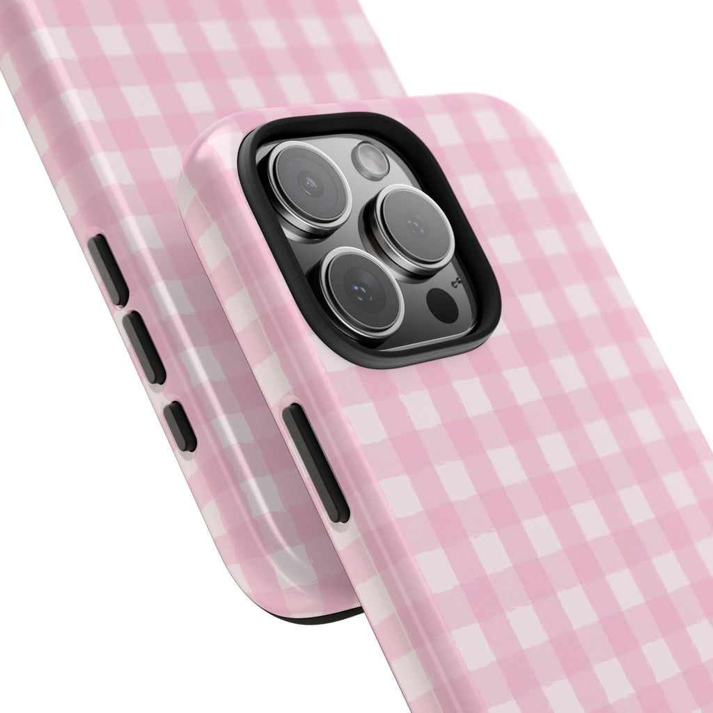 Pink gingham phone case angled view, side button cutouts and camera lens opening