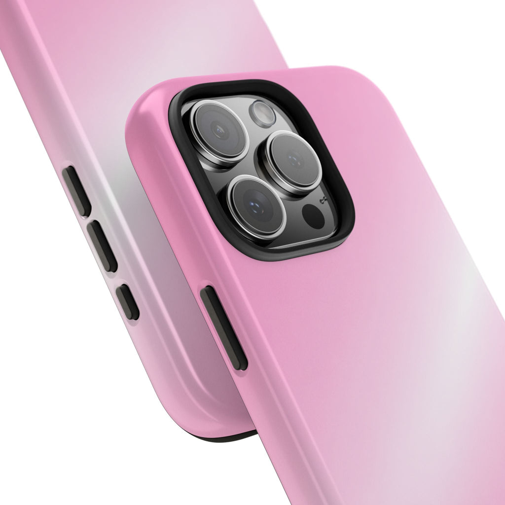 Close-up of pink glossy phone case with camera lens cutouts and side ports