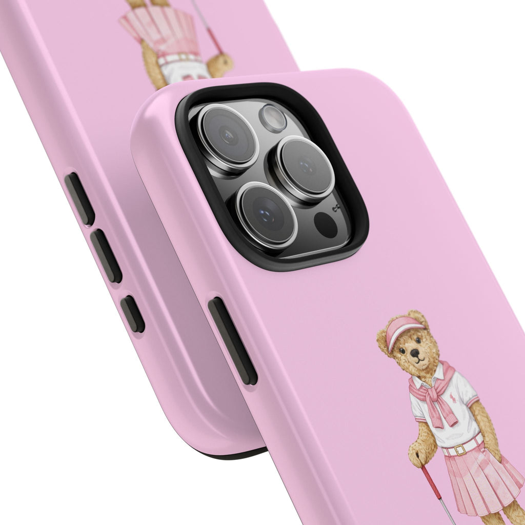 Pink phone case close-up showing teddy bear print and side button cutouts.