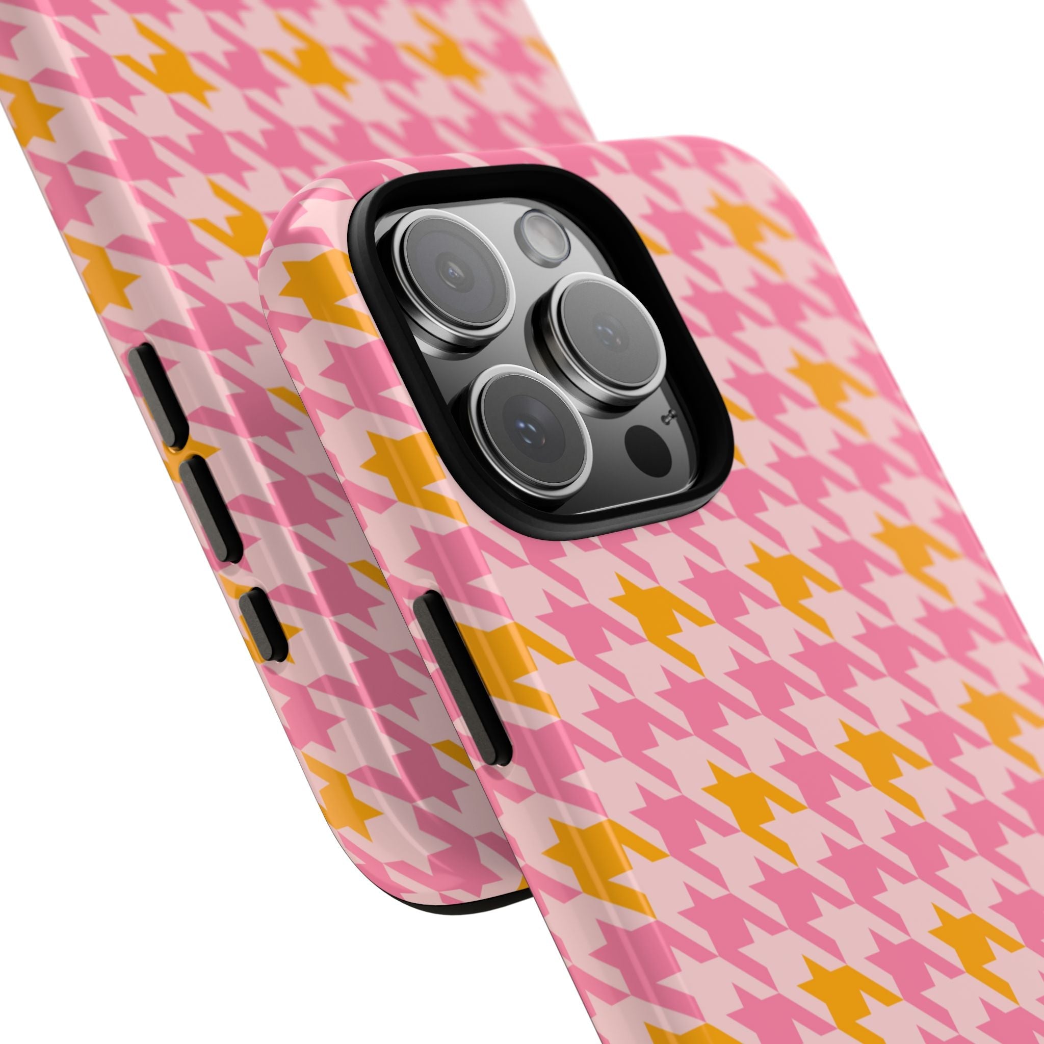 Pink houndstooth phone case, angled view with camera lens cutout and side buttons