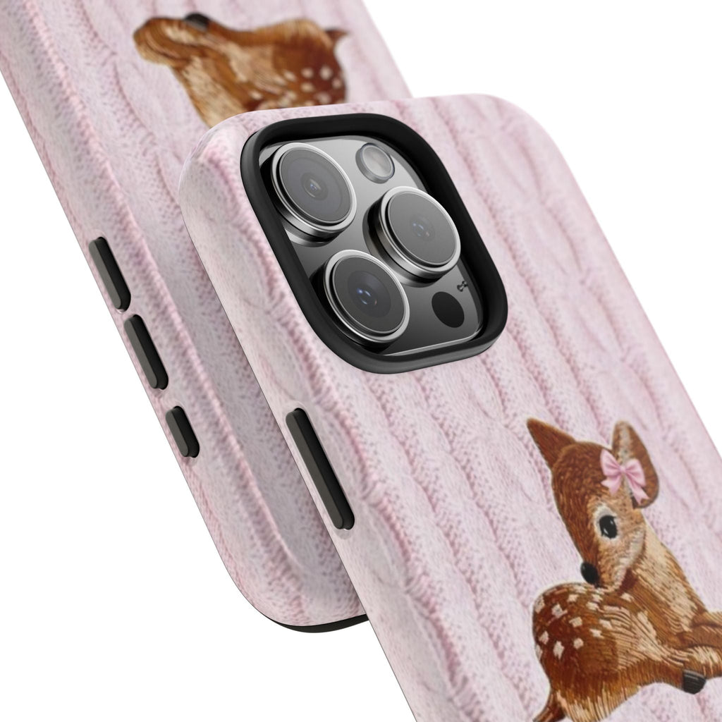 Side view of pink knit phone case with deer bunny print, visible buttons and camera lenses