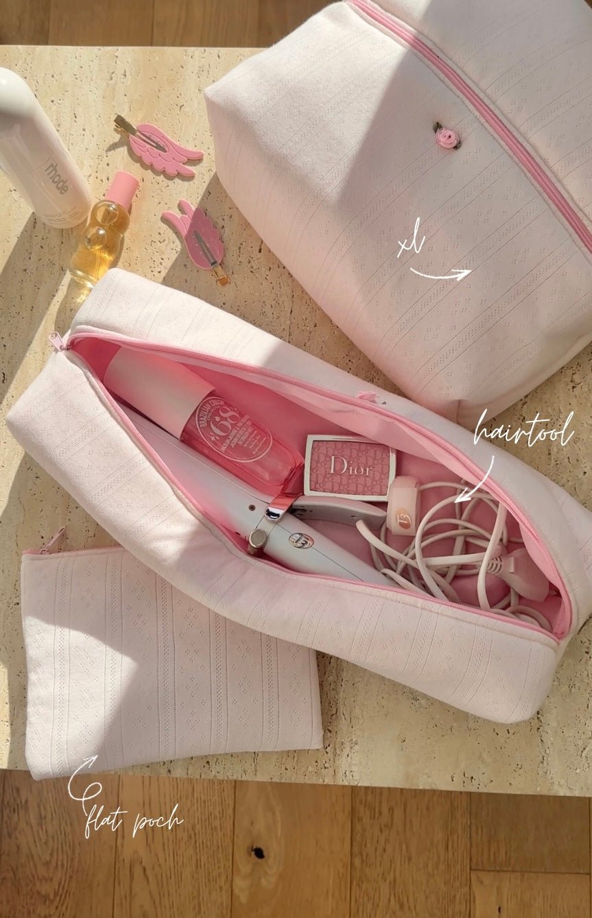 White lace-knit jacquard toiletry pouch, open top with pink interior and zipper