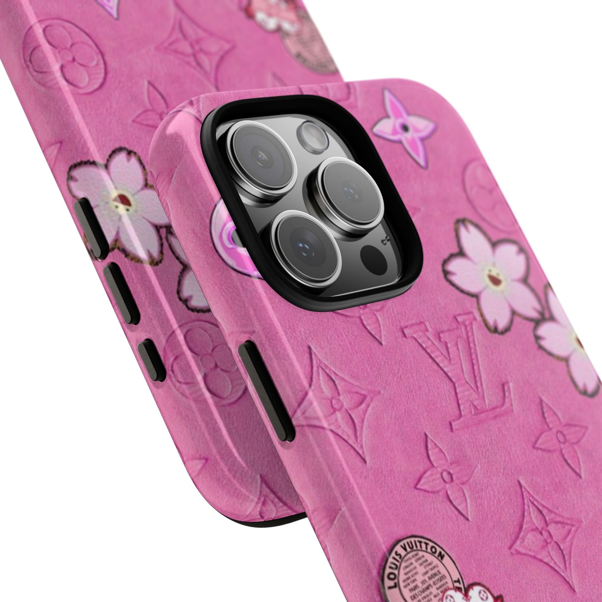 Pink kawaii phone case detail view: camera cutout with raised lens and flower pattern