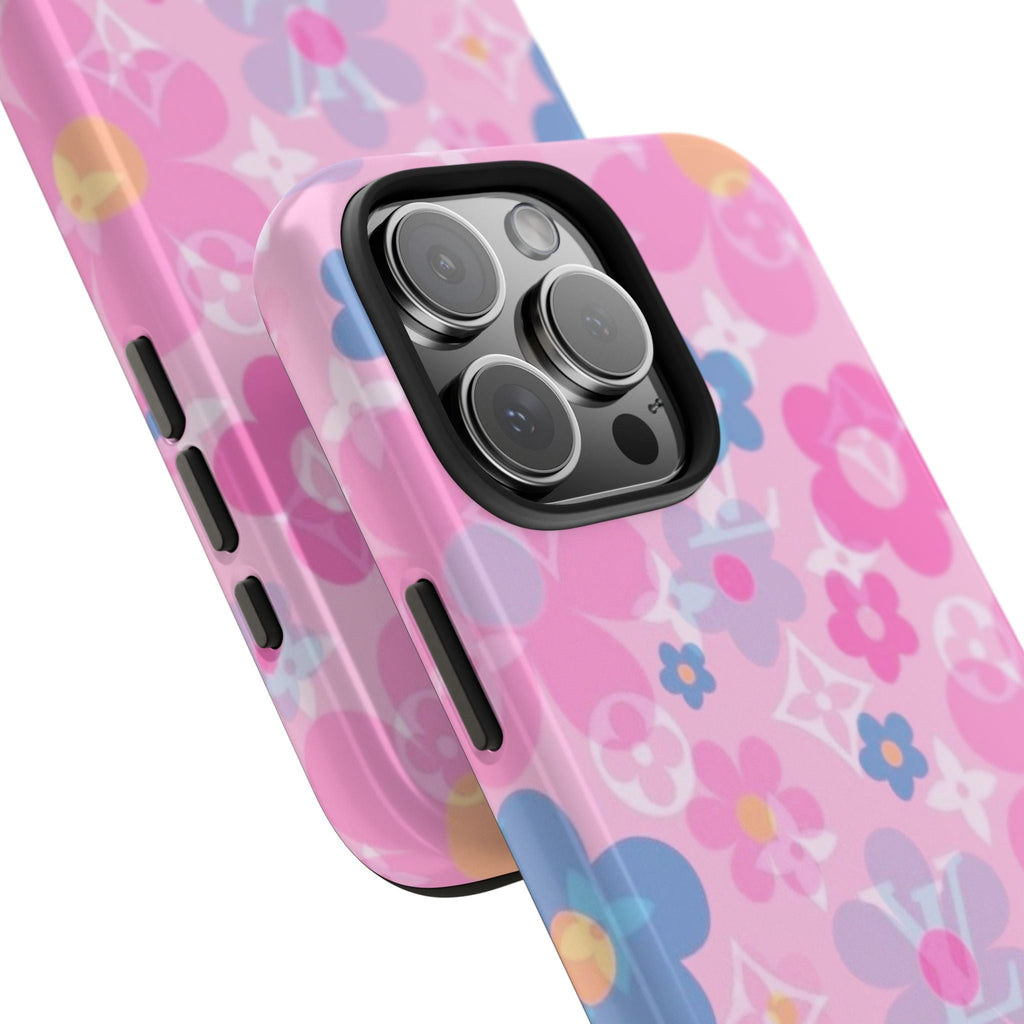 Angled view of pink floral daisy phone case with camera bump cutout