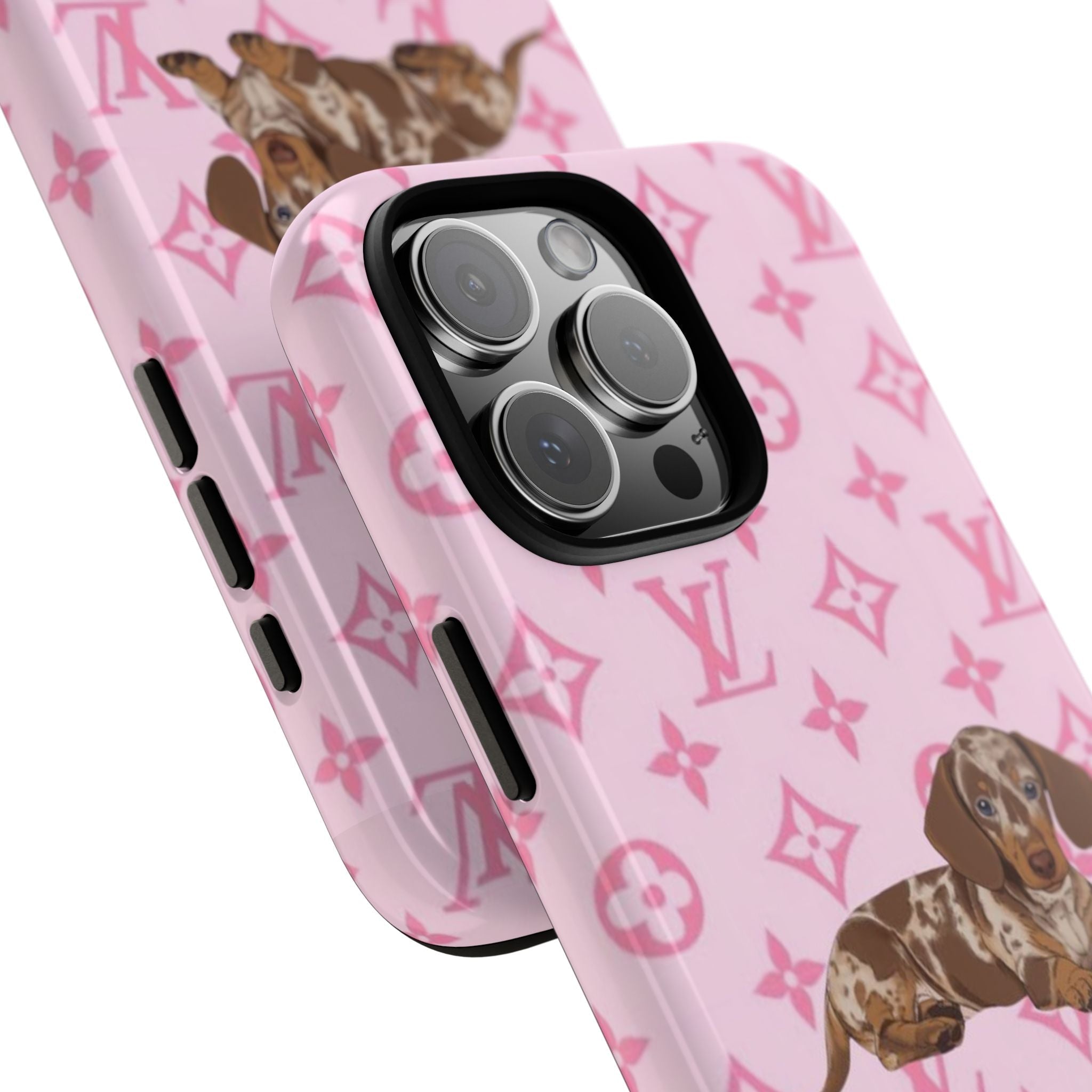 Angled pink weenie dog phone case with LV-style monogram pattern and camera lens cover