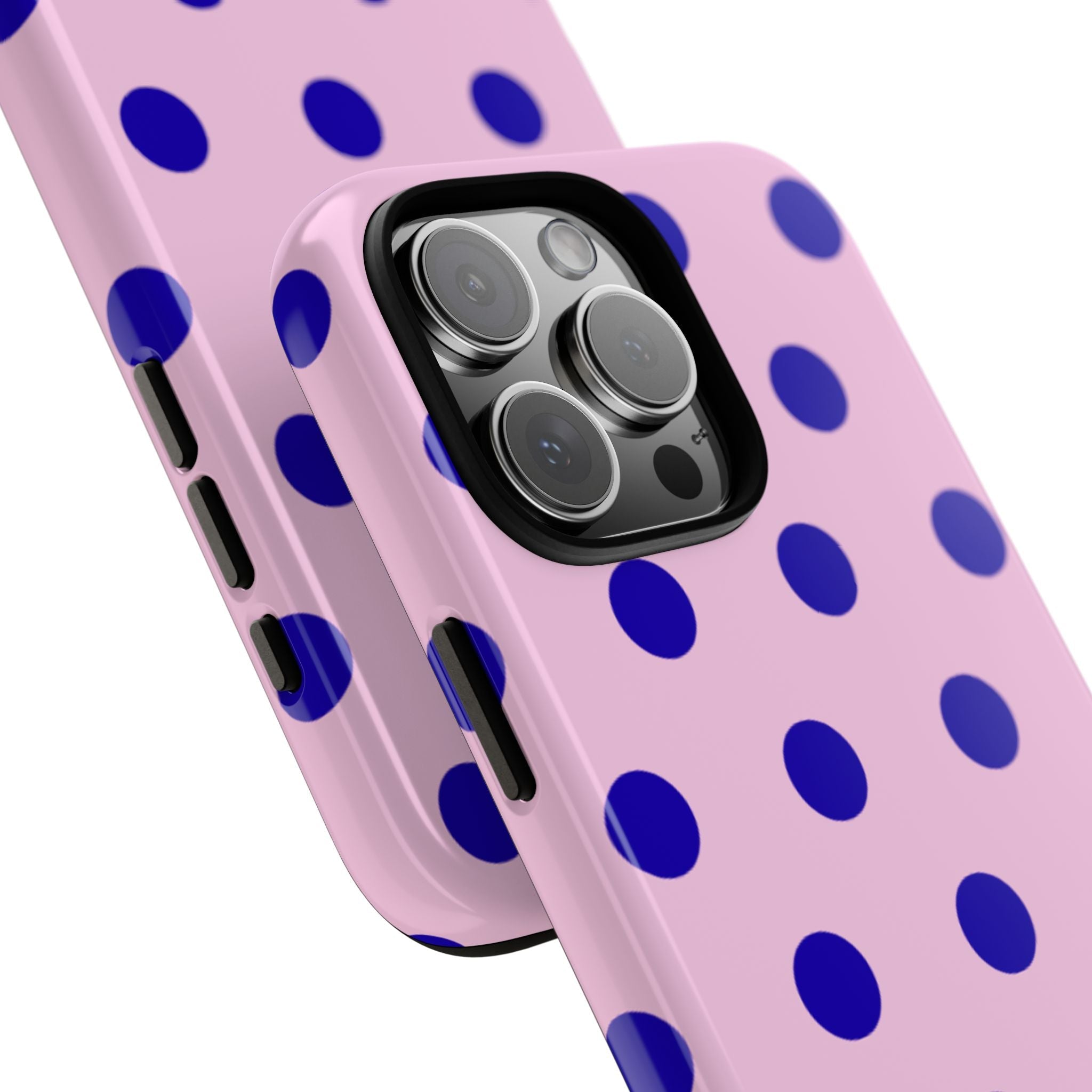 Pink polka-dot phone case with blue dots, showing side cutouts and camera lens