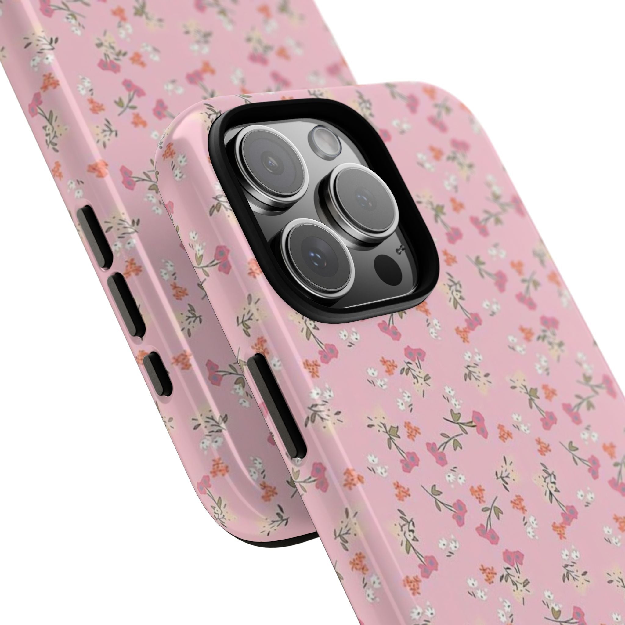 Pink ditsy floral phone case corner view with lens openings and textured edge