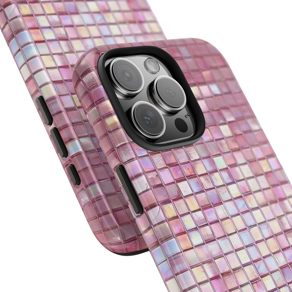 Angled pink mosaic phone case with raised camera frame and square grid pattern