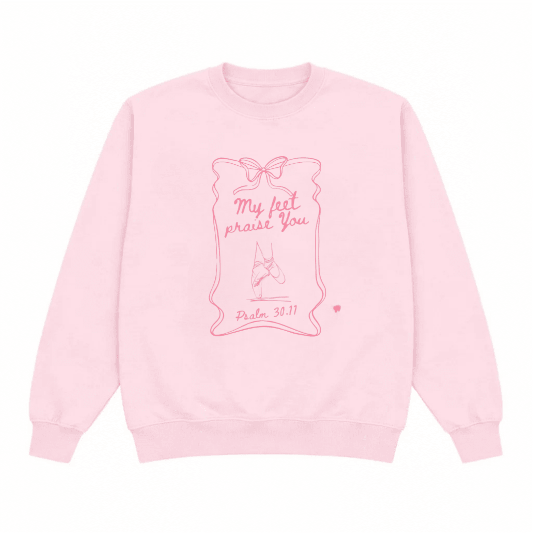 Pink crewneck sweatshirt with ballerina bow outline and “My feet praise You” print