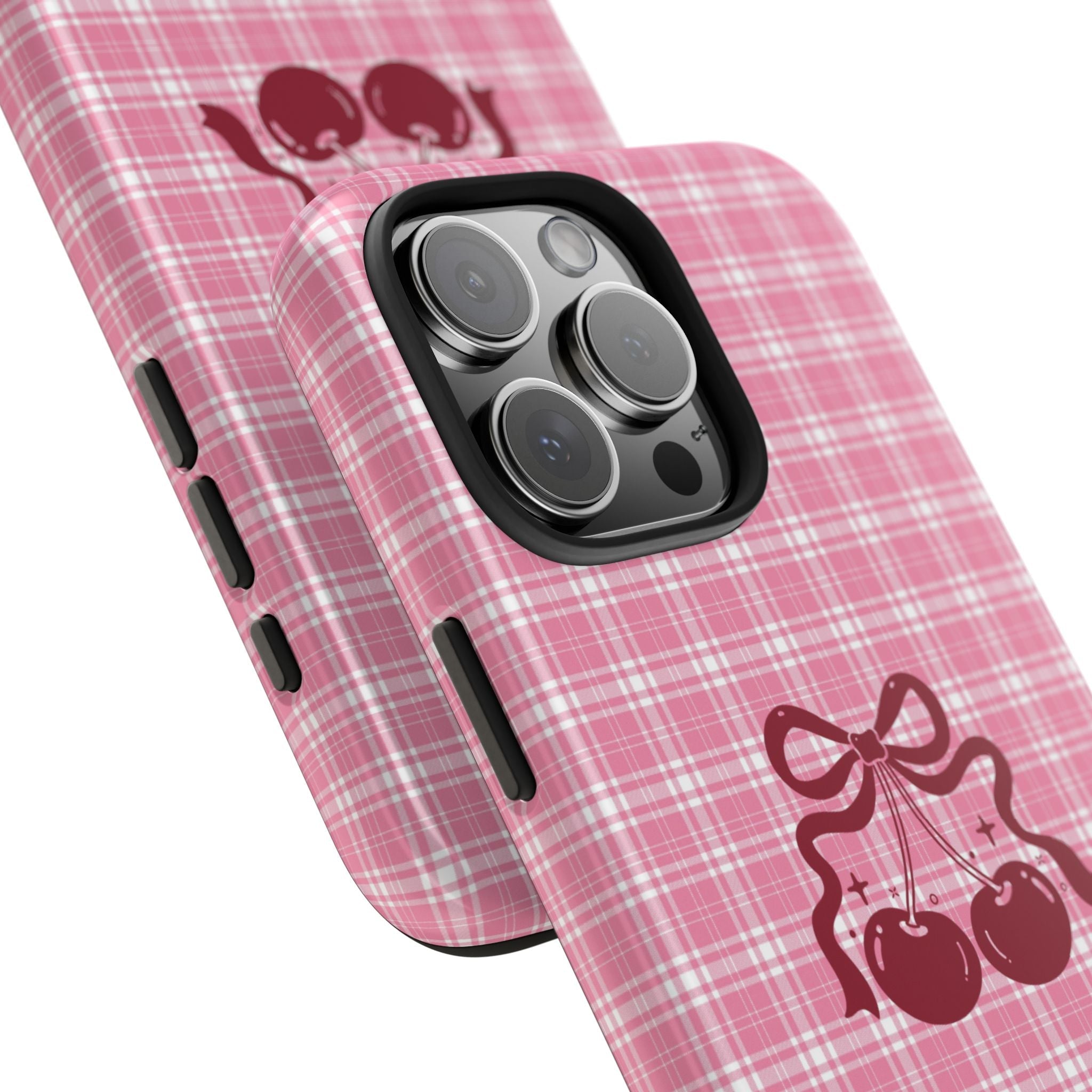 Pink plaid phone case angled view with cherry bow cherries graphic and side buttons