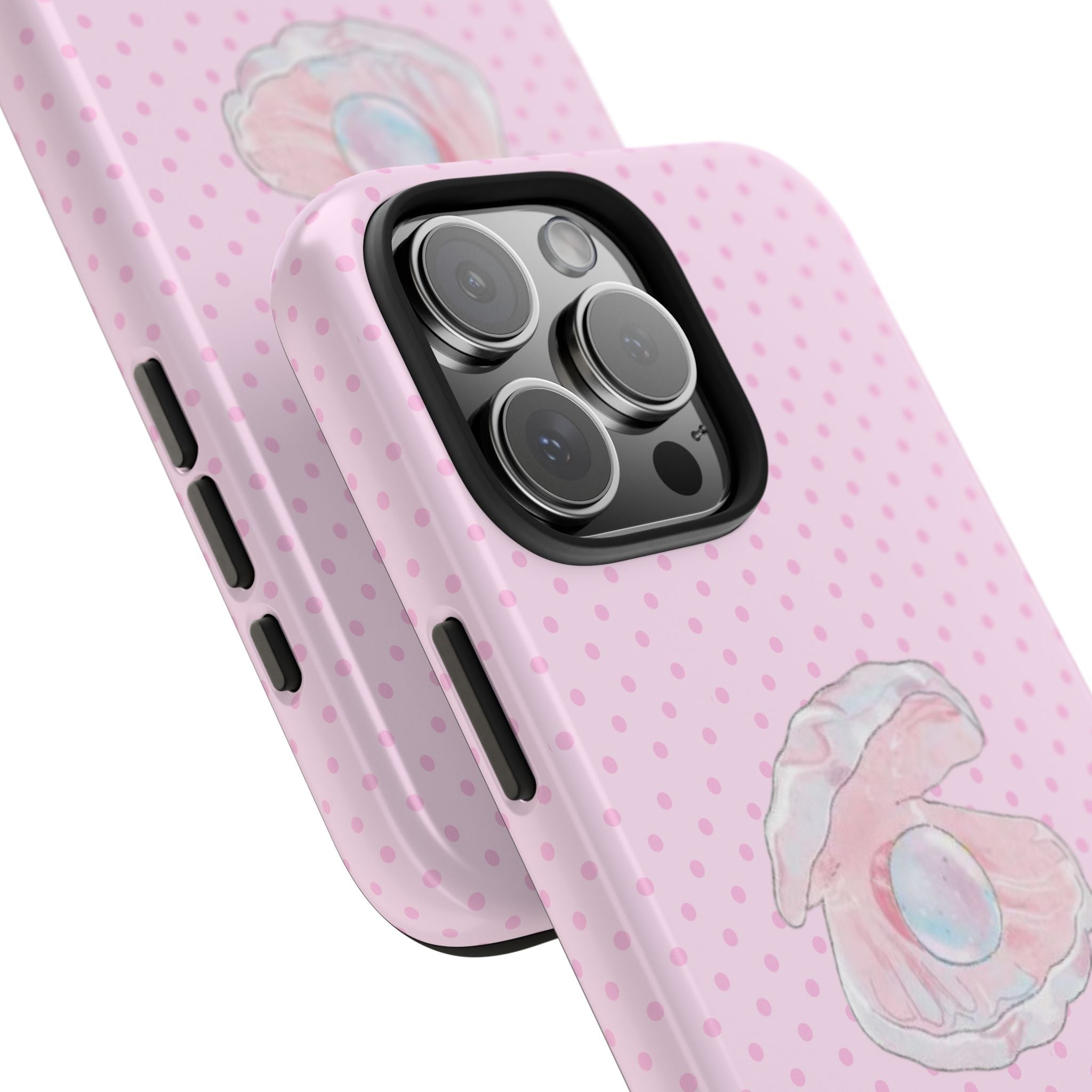 Angled view: pink polka dot mermaid shell phone case with camera lenses and side buttons