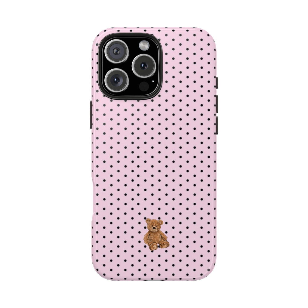 Pink polka dot phone case with teddy bear charm near the bottom center
