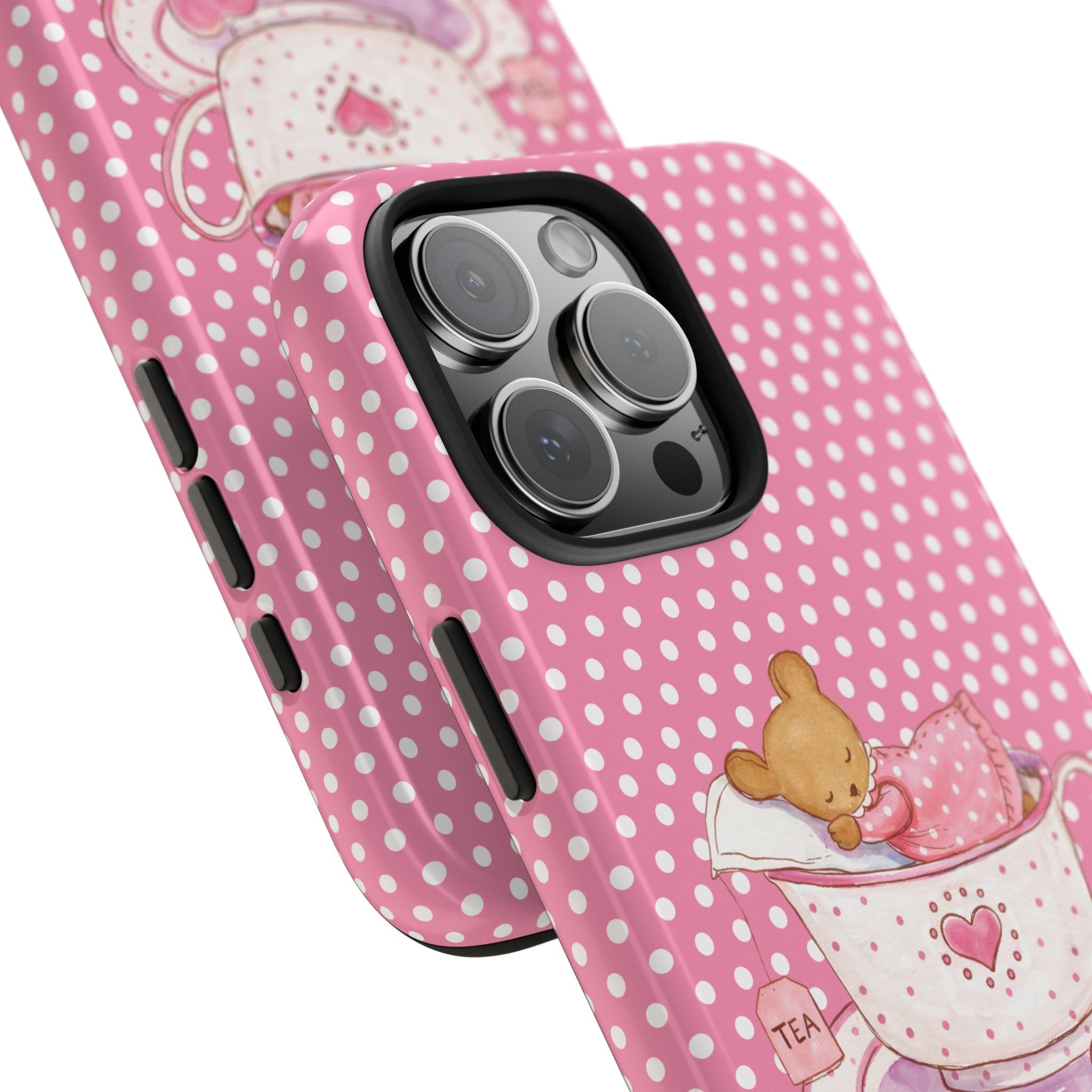 Pink polka-dot phone case, angled view, teddy bear in teacup; camera cutout visible