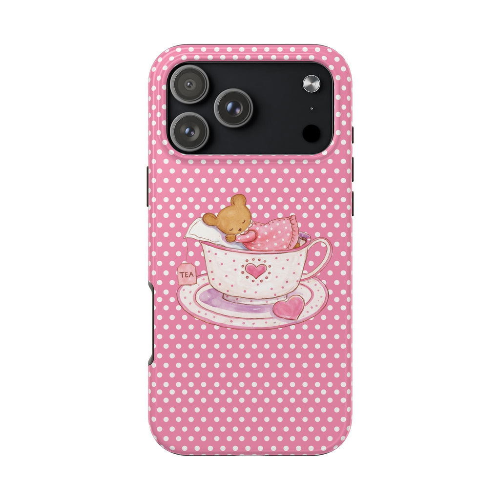 Pink polka-dot phone case featuring teddy bear tucked in teacup with heart