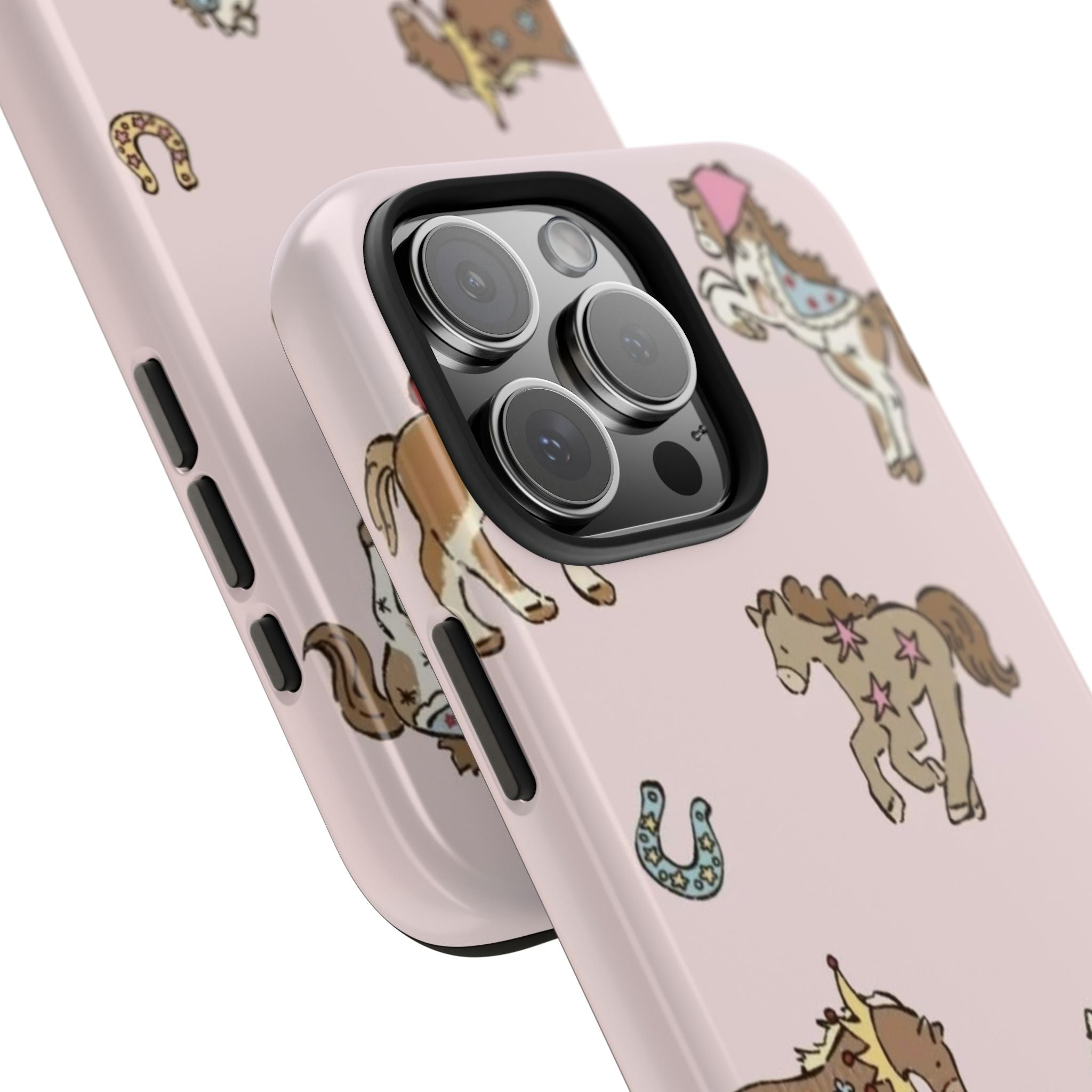 Close-up light pink phone case showing camera lenses and side button cutouts with ponies