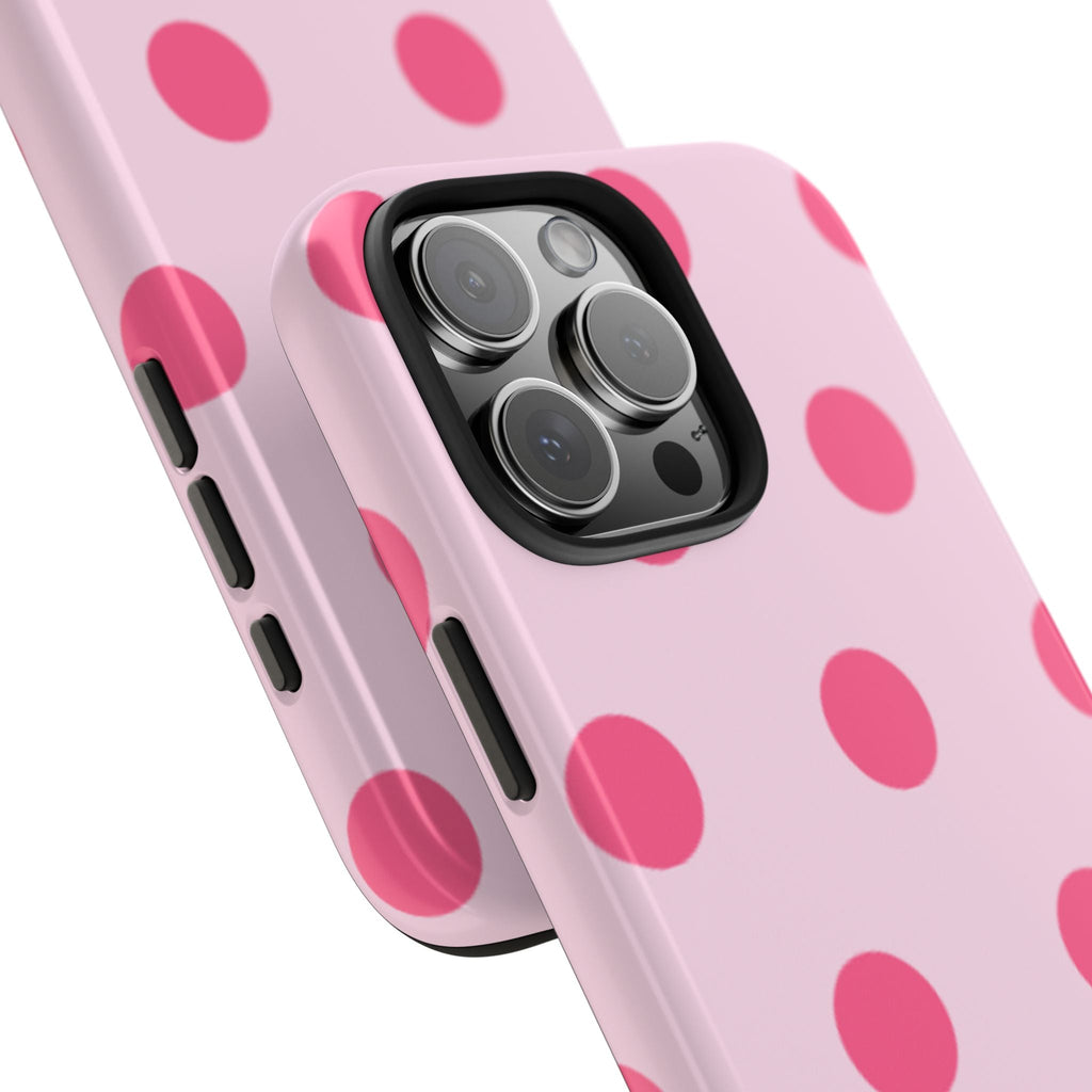 Close-up of pink polka dot phone case showing camera lenses and port cutouts