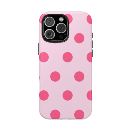Pink polka dot phone case with raised camera frame and side button openings