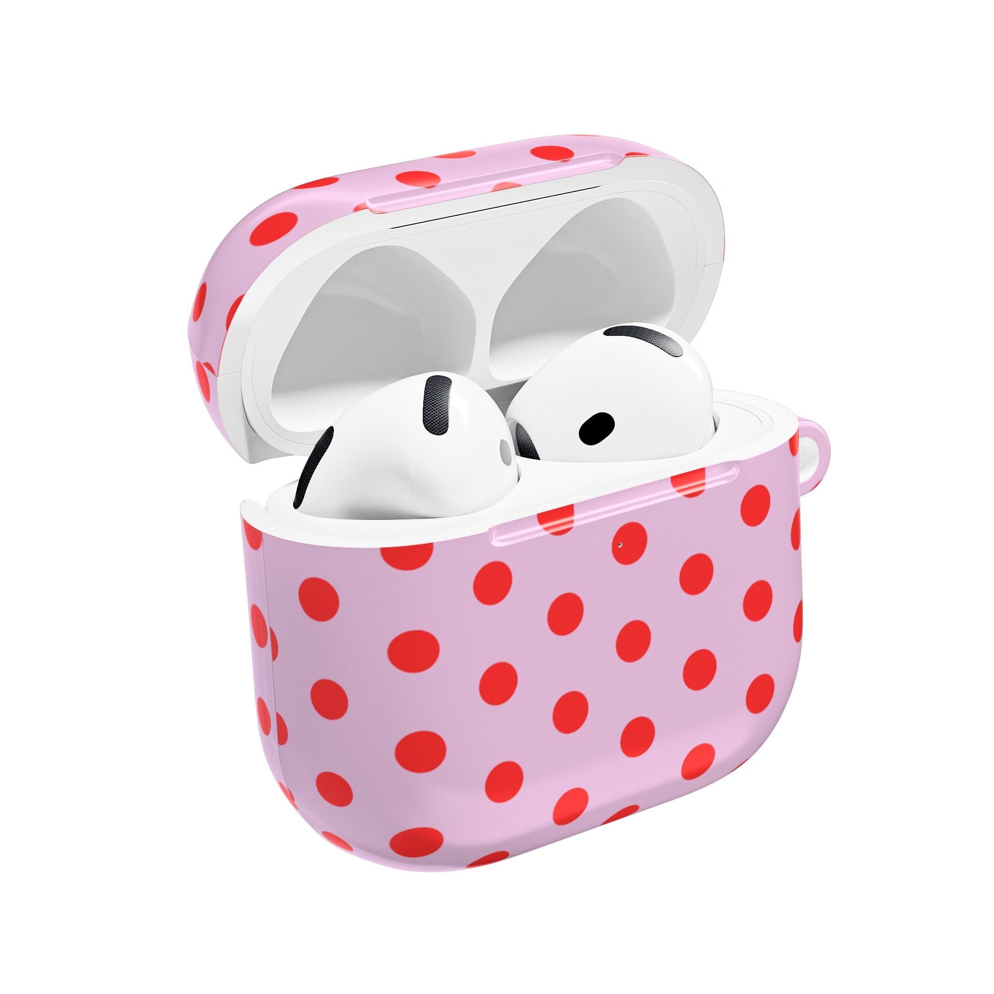 Pink AirPod case with red polka dots, lid open and white earbuds inside