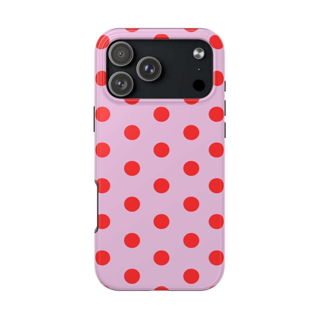 Pink phone case with red polka dots pattern and camera cutout on back