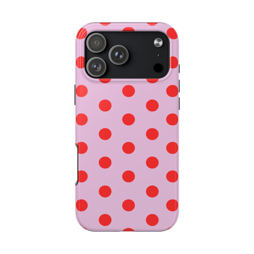 Pink phone case with red polka dots pattern and camera cutout on back