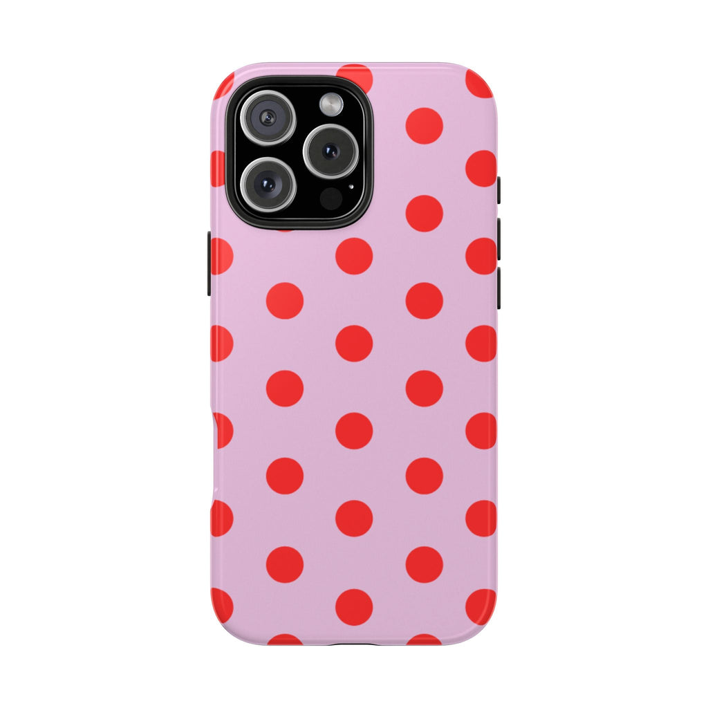 Pink polka dot phone case with red spots and raised camera area