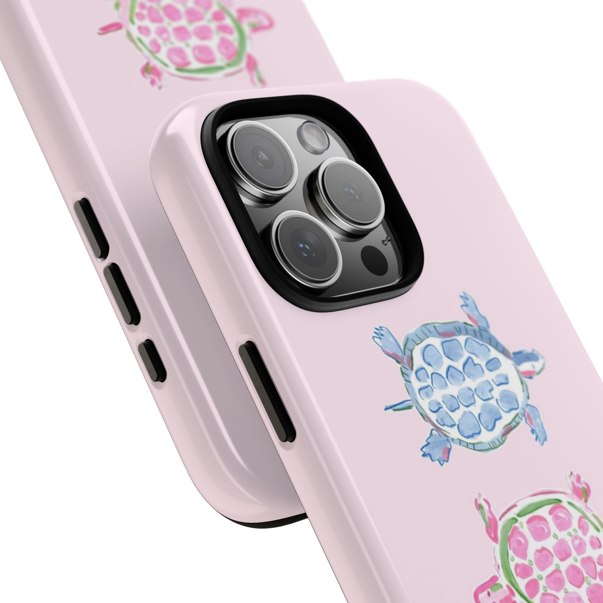 Angled view of pink sea turtle phone case showing camera lens cutouts and side buttons