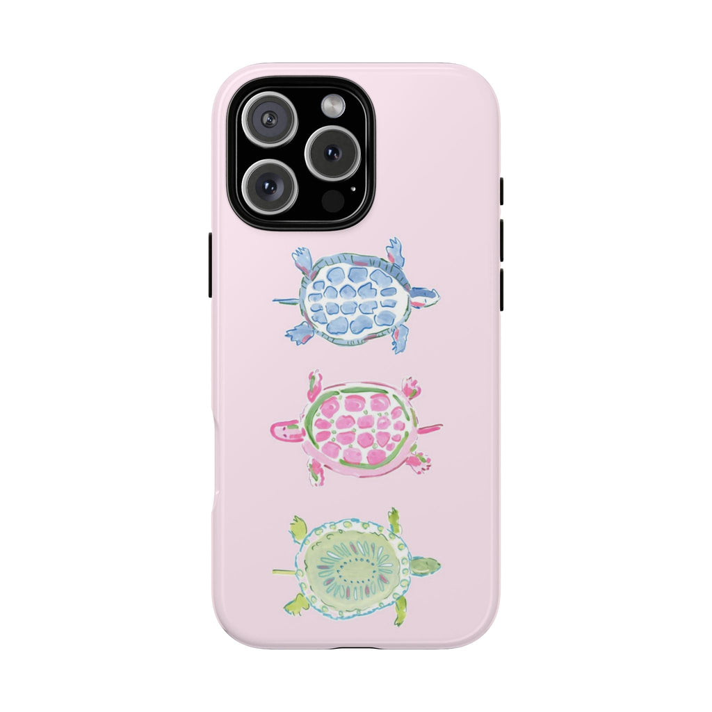 Pink phone case with three illustrated sea turtles, glossy finish and camera cutout