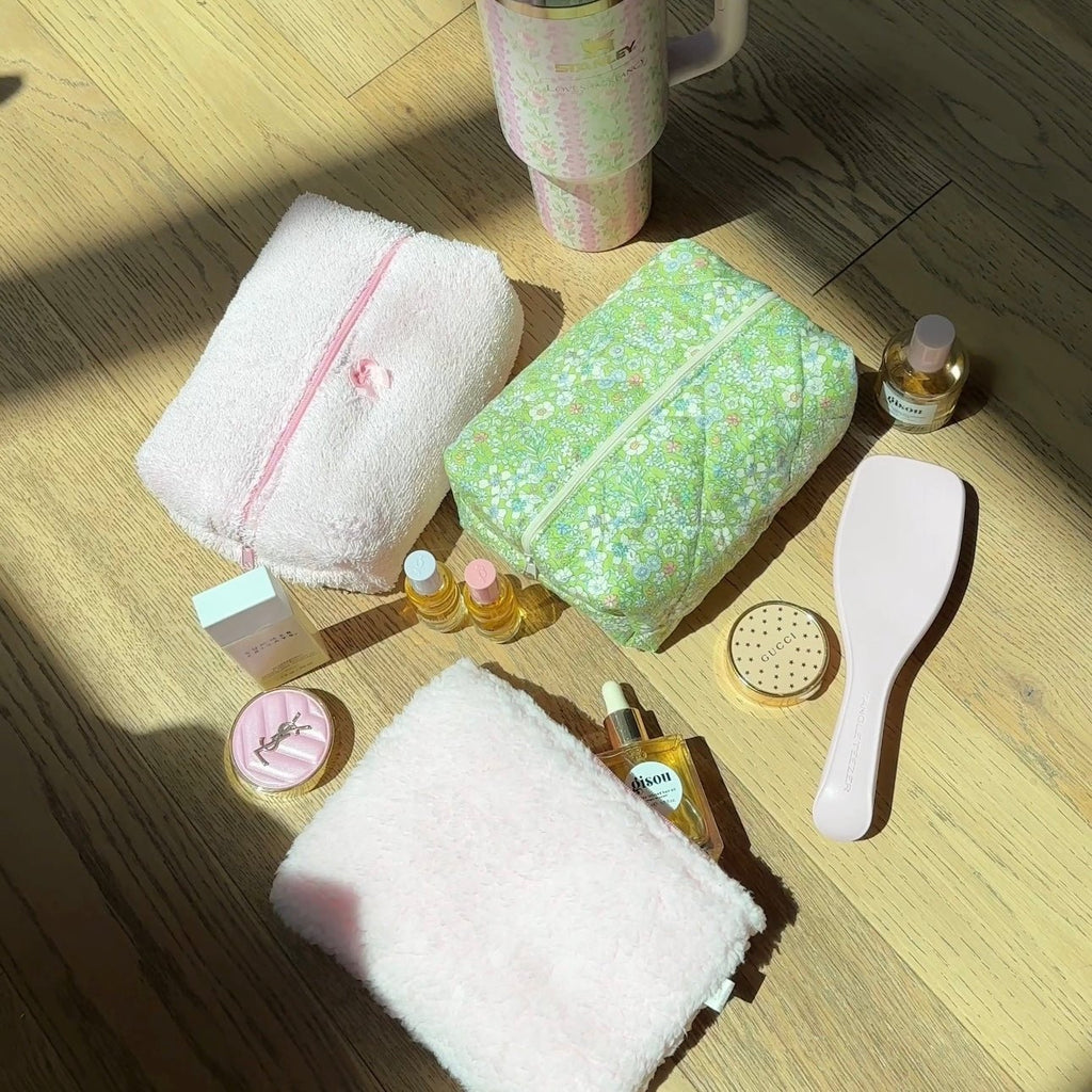 Open green floral zip pouch, top opening with interior lining