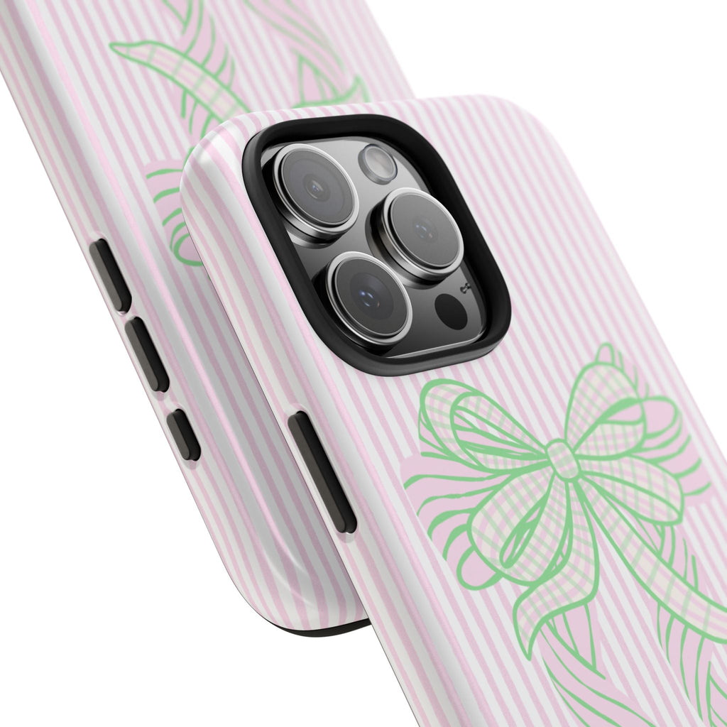 Angled pink striped phone case showing green bow and camera lens openings
