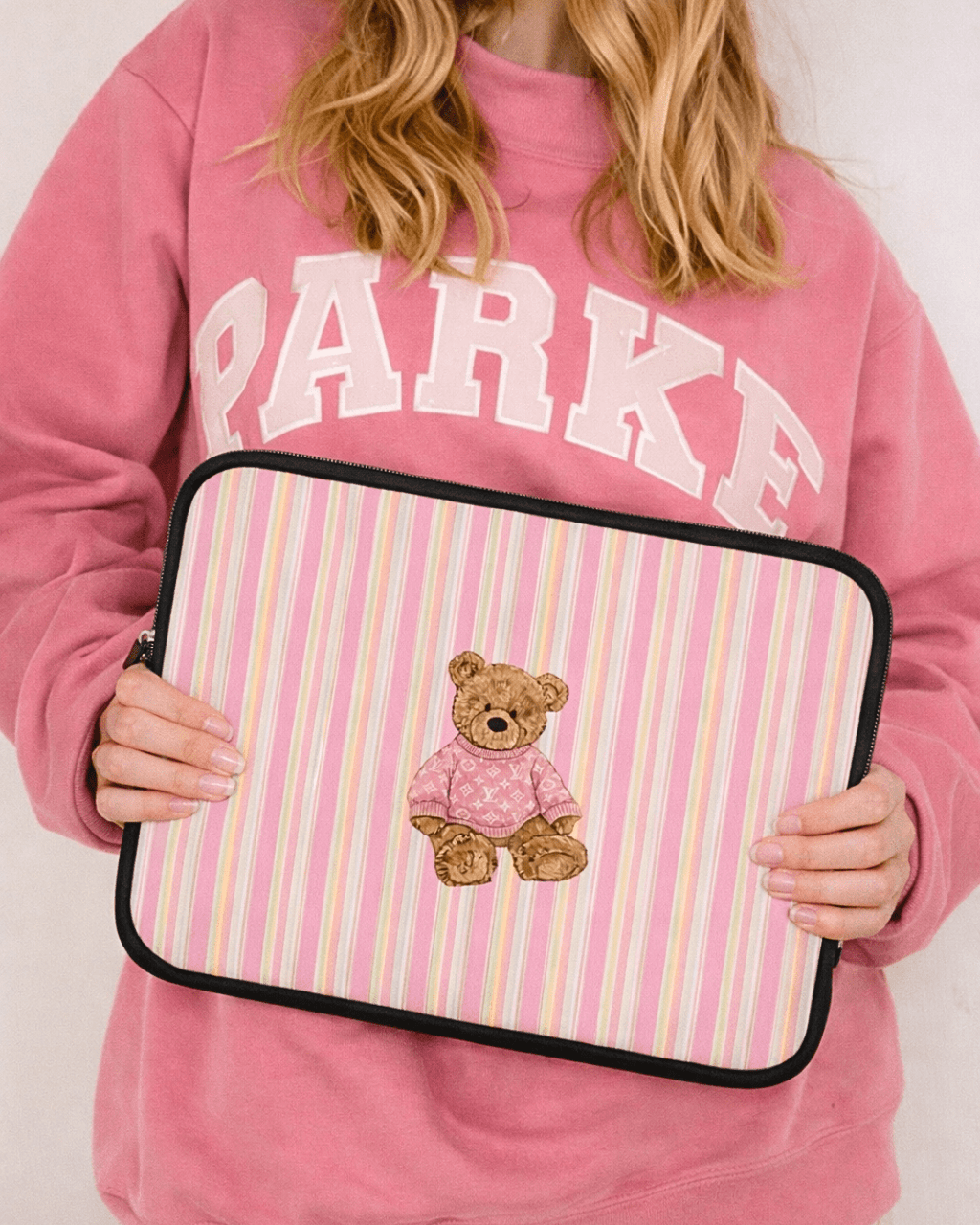 Pink striped neoprene device sleeve with teddy bear patch and black zipper trim