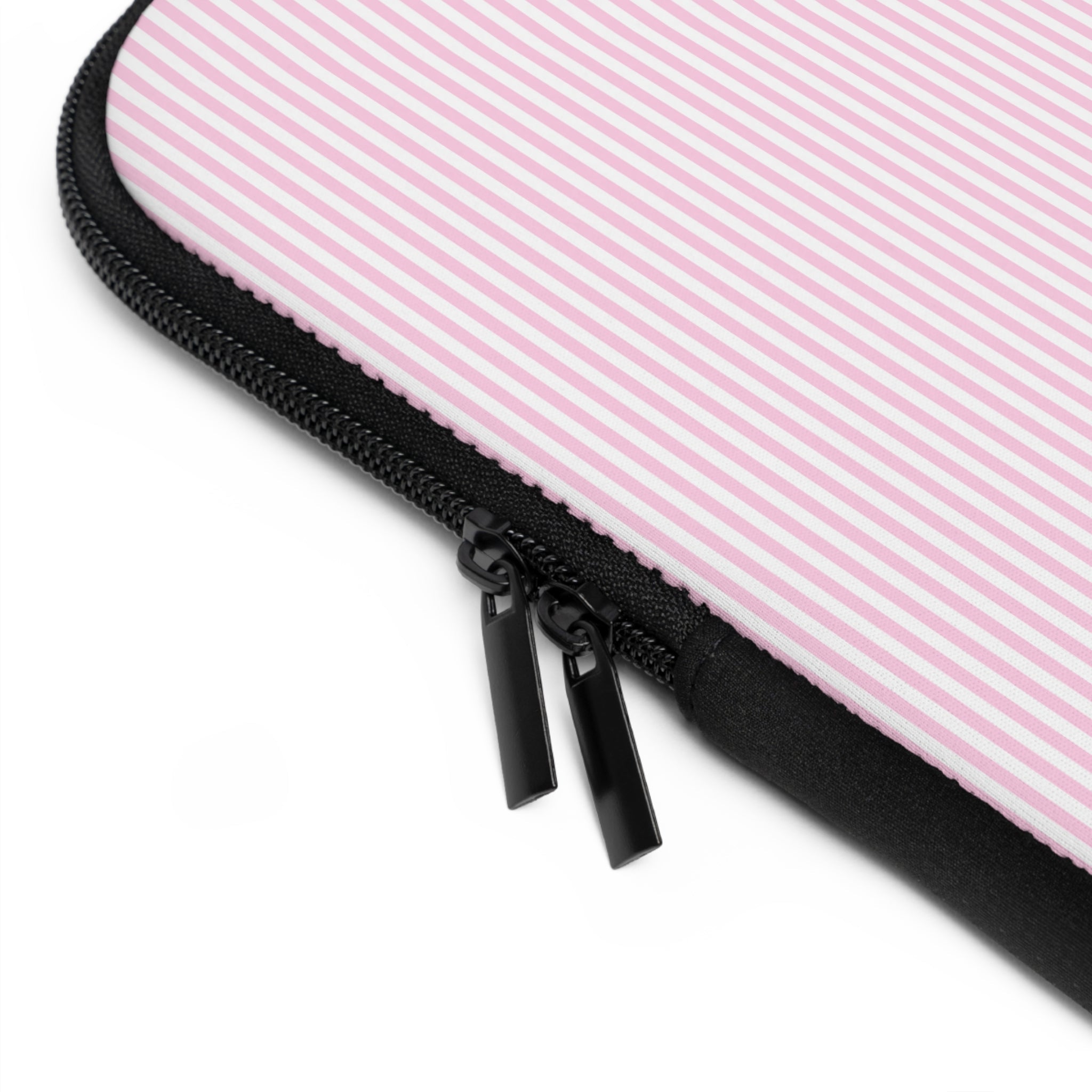 Close-up of black zipper on pink striped neoprene sleeve edge