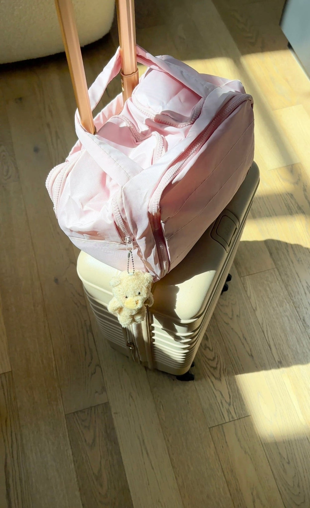 Pink waterproof organizer bag open with side pockets and long zipper pull
