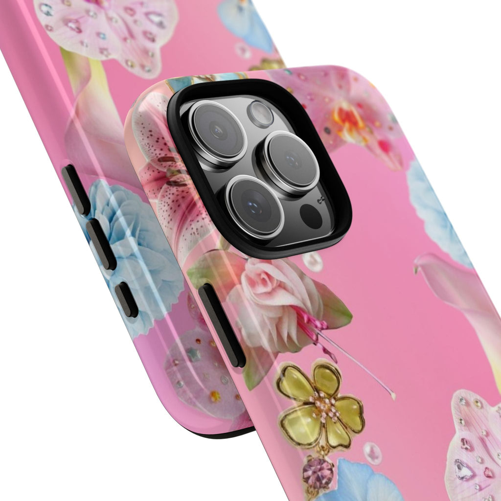 Close-up pink floral phone case with rhinestone lily details and ornate flower accents.