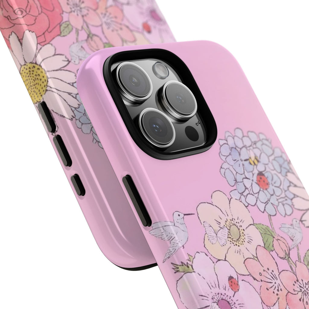 Pink floral phone case close-up with blossoms, leaves, and bird illustration
