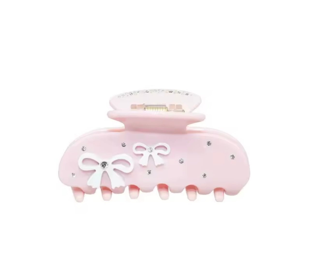 Light pink hair claw with white bows and rhinestone accents, wide grip teeth
