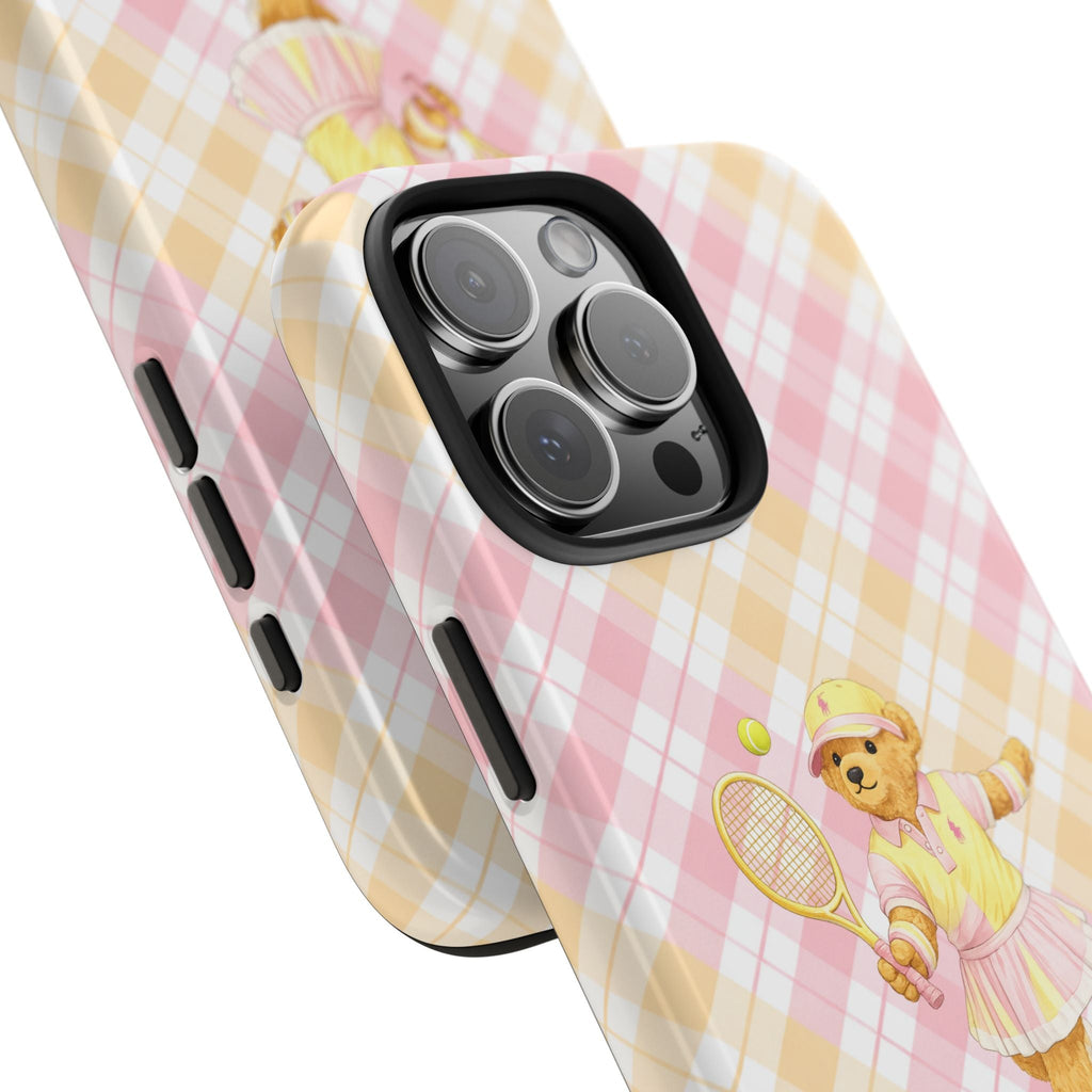 Pink & yellow checkered phone case with tennis teddy bear, angled side view