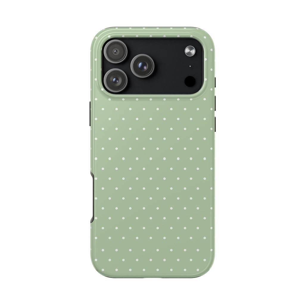 Pistachio green phone case with white polka dots, camera openings visible