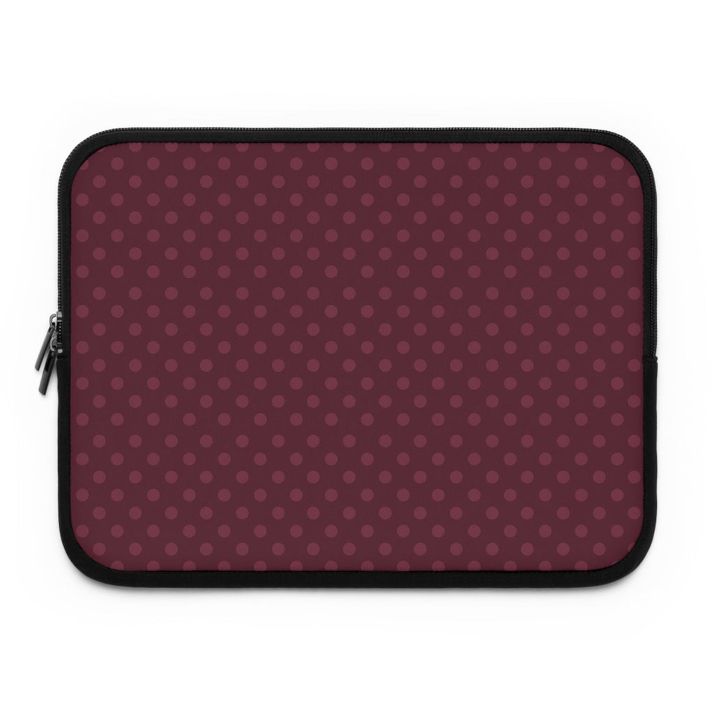 Plum polka-dot neoprene sleeve with black zipper trim.