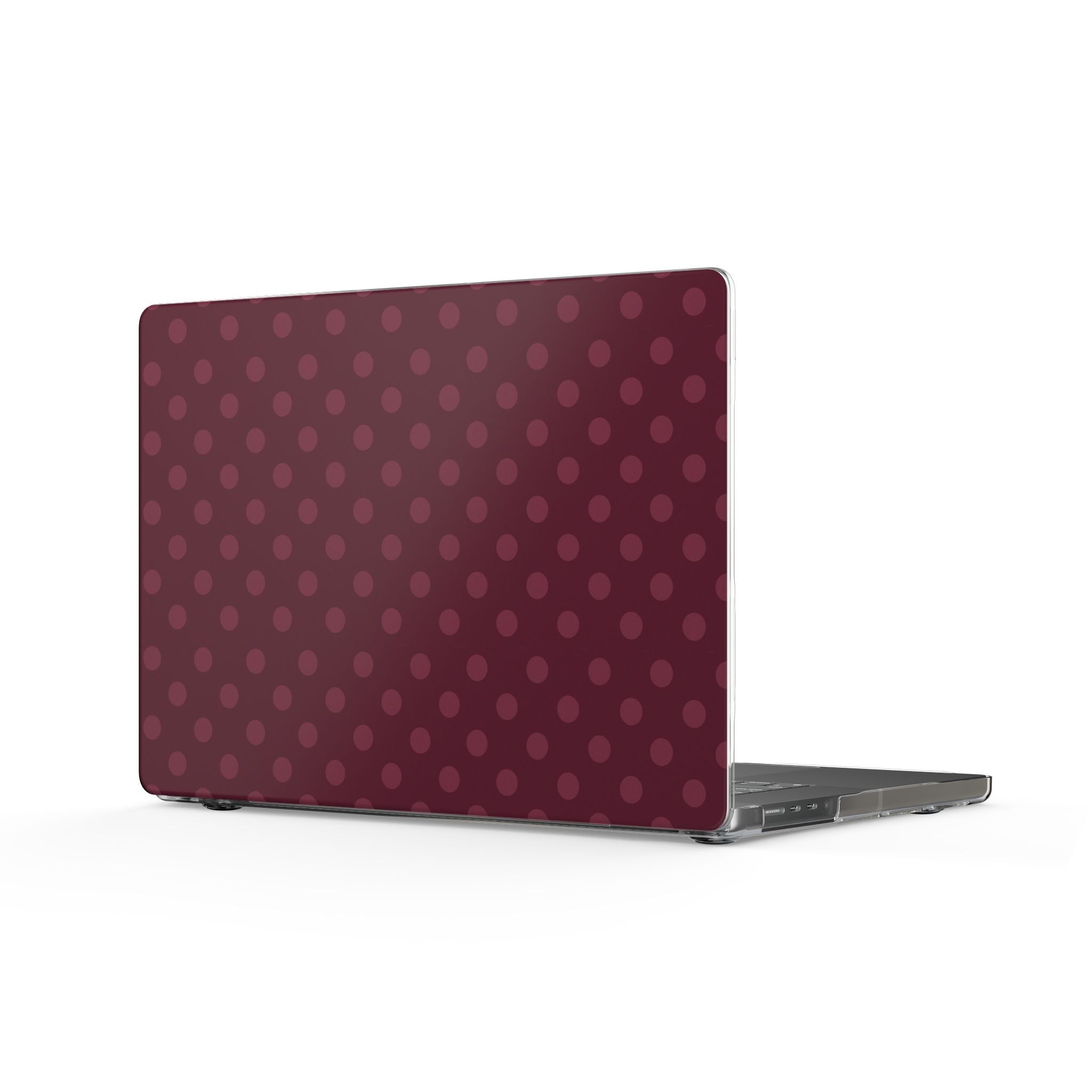 Hard shell MacBook cover with plum polka dot pattern and clear edges