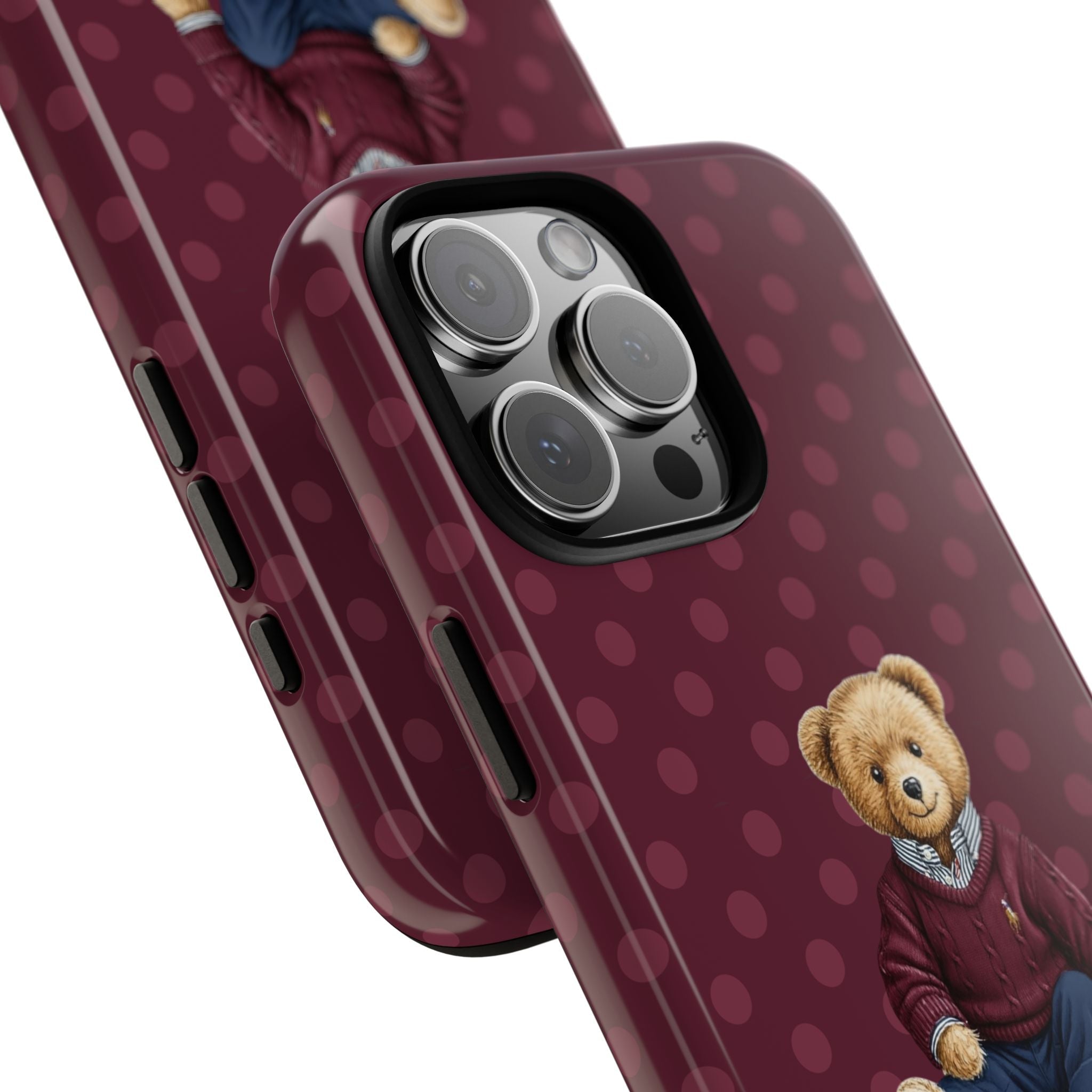 Angled plum polka dot phone case with teddy bear and raised camera lenses