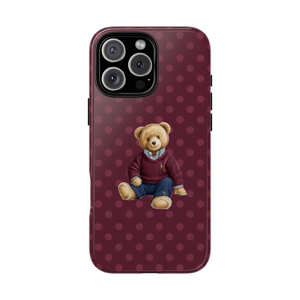 Plum polka dot phone case with seated teddy bear graphic and camera cutout