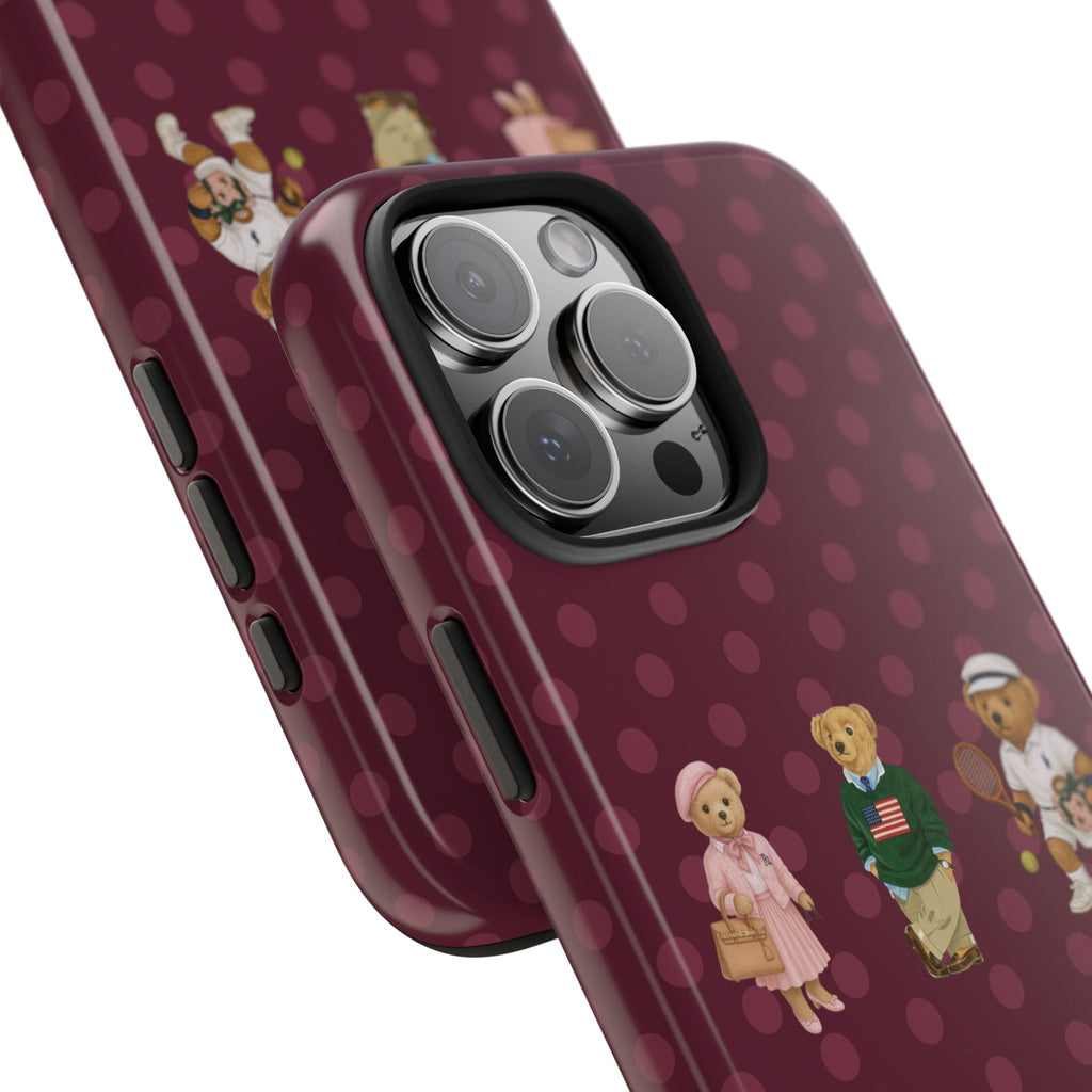 Plum polka dot phone case with teddy bear graphic and side buttons, camera bump visible