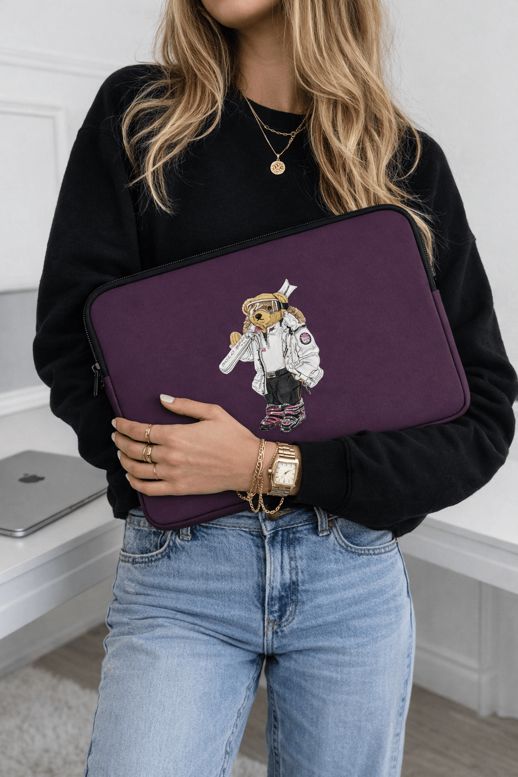 Plum neoprene tablet/laptop sleeve with black trim and skier teddy bear patch