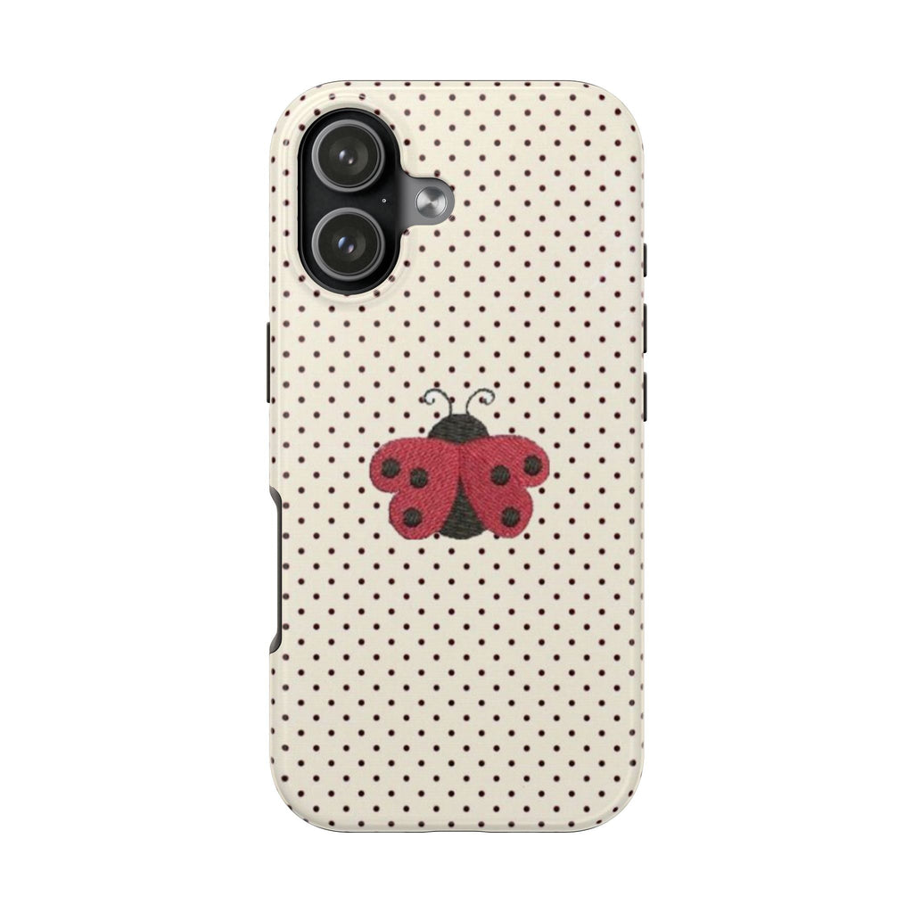 Cream polka-dot phone case with red ladybug coquette graphic and camera cutout