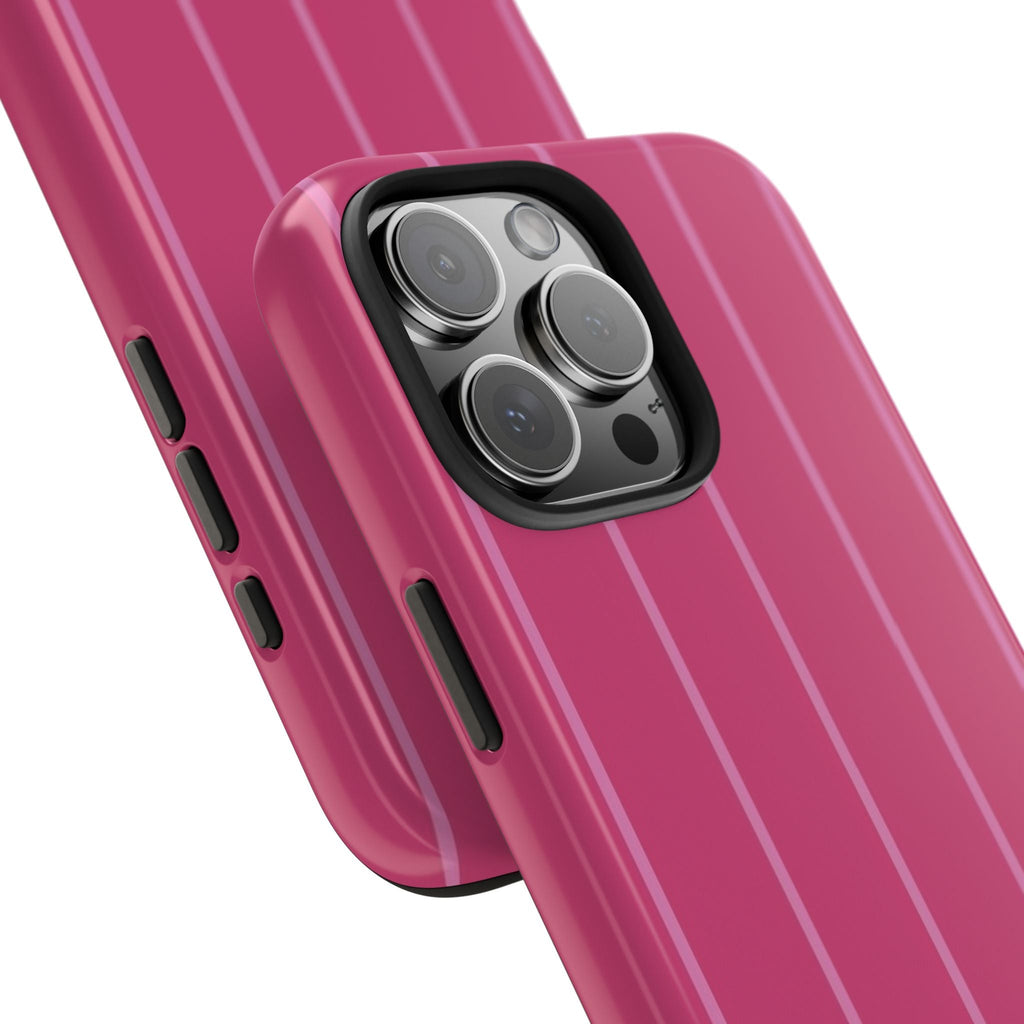 Close-up of poppy pink phone case with minimal vertical stripes and camera lens openings