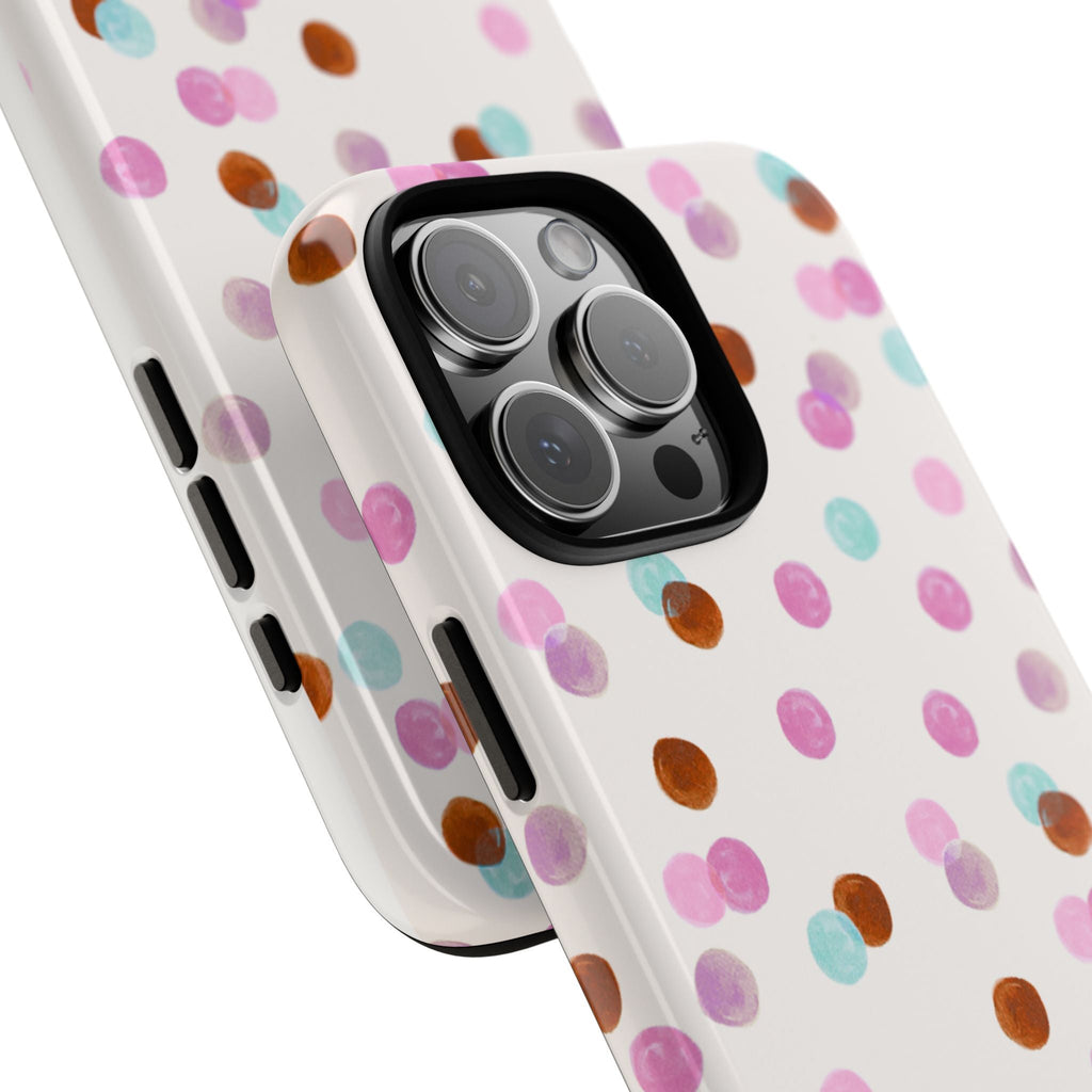 Angled view of white polka-dot phone case with side button cutouts and camera opening